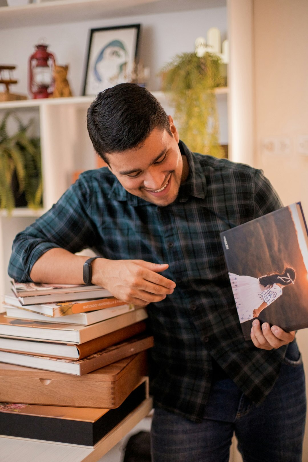 Portrait of the founder of the photography project reviewing prints