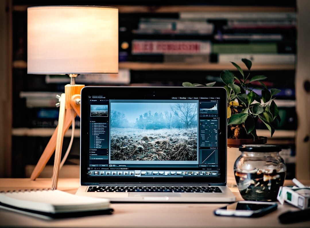 photographer editing photos on laptop