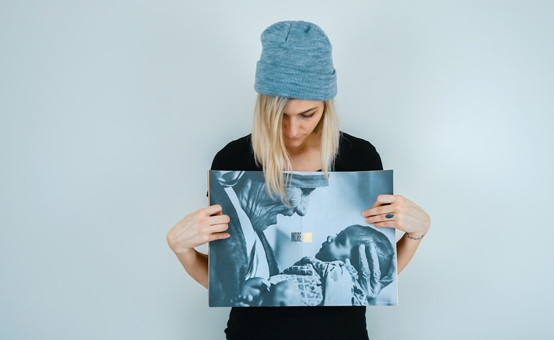 person holding framed photo