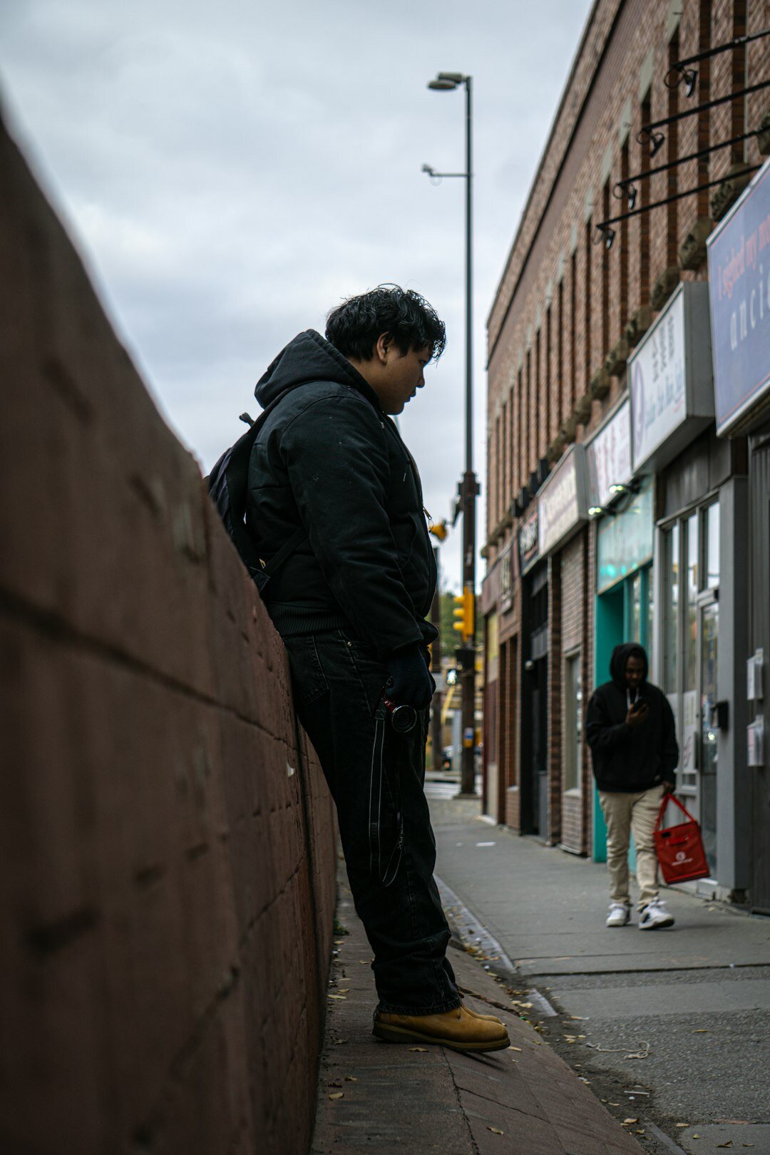 person walking on city street